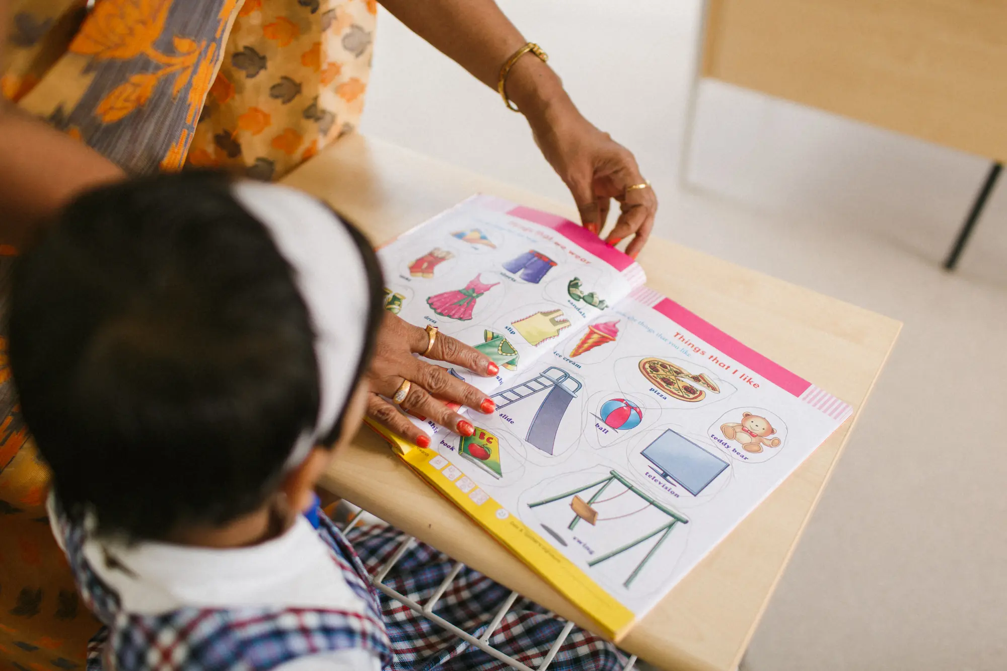 photo of young girl studying from a book